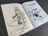 someone is drawing a picture of a man with a gun in a book