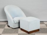 an image of a blue chair and ottoman on a checkered floor