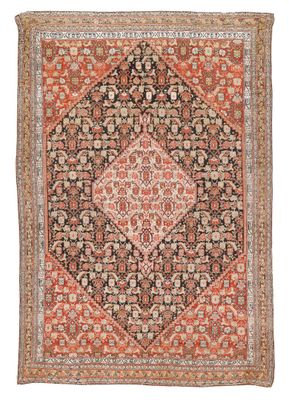 un tapis orange et noir à motifs en losanges