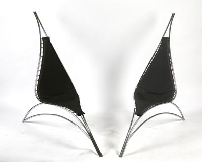 pair of black and silver chairs on a white background