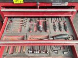 a red tool box with many tools in it