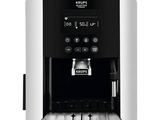a coffee machine with coffee beans on top of it