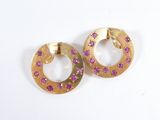 pair of gold tone earrings with pink stones on a white background