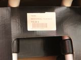 a black box with a sticker on it that says back special touch