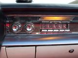 an image of a car dashboard with a clock and radio