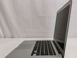 a laptop that is sitting on a white surface