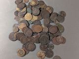 a pile of old coins on a table