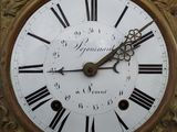 a clock with roman numerals on the face of it