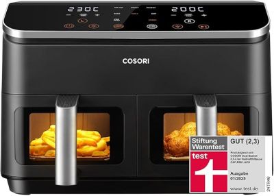 un gros plan d'une friteuse à air chaud noire et argentée contenant des aliments