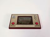 an image of a nintendo game console sitting on top of a white table