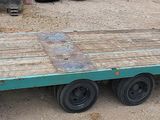 a flatbed trailer that is parked in a lot