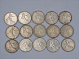 a close up of a bunch of coins sitting on top of a table