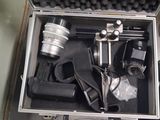 a metal case with a camera and other items in it