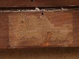 a piece of wood that has a stamp on it