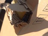 a cardboard box with a piece of paper on it