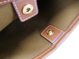 a close up of a brown bag with a handle