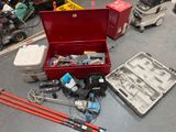a red tool box filled with tools on the floor