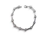 a close up of a bracelet on a white surface