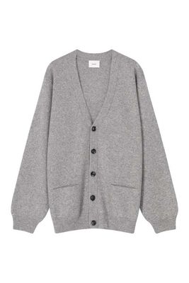 a close up of a sweater with buttons on a white background