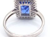 an image of a blue sapphire and diamond ring on a white background