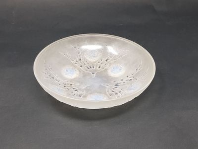 an image of a clear glass bowl on a black surface