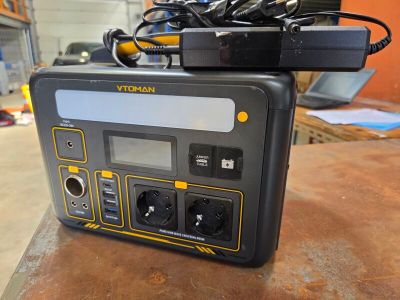 a black and yellow electronic device on top of a table