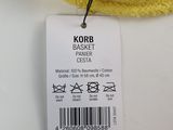 a yellow knitted hat with a tag attached to it