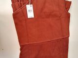 a close up of a pair of red sweaters on a table