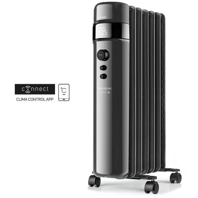 an image of a black and silver electric heater sitting on top of a table