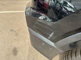 a close up of a car ' s bumper with a sticker on it