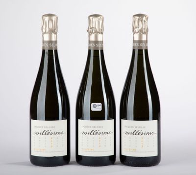 three bottles of wine sitting next to each other on a table