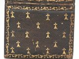 an old black and gold box with crosses and crosses on it