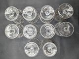 several empty wine glasses sitting on top of a black table