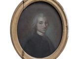 portrait d'un homme en manteau noir, dans un cadre ovale doré
