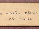 an old piece of paper with writing on it sitting on a table