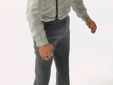 a figurine of a man with a tie and suspenders