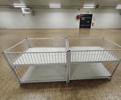 a metal cage that is in the middle of a room
