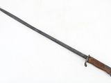 a knife with a wooden handle on a white surface