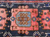 an image of a blue and pink rug with a design on it