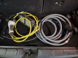 a trunk of a car with a bunch of cables in it