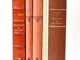 three books that are sitting next to each other on a table