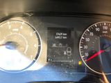 a close up of a car dashboard with a speedometer
