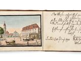 an open book with a picture of a town and a picture of a church