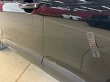 a close up of a car door handle with a sticker on it