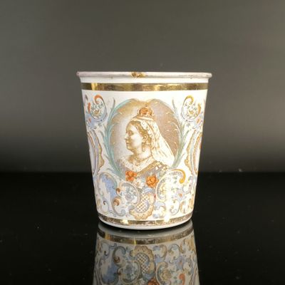 a cup that has a picture of a woman on it