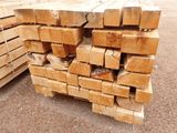several pieces of wood stacked on top of each other in a pile