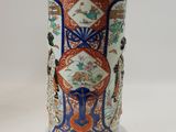 a vase that is sitting on a white table
