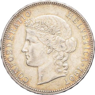 a close up of a coin with a woman ' s head on it