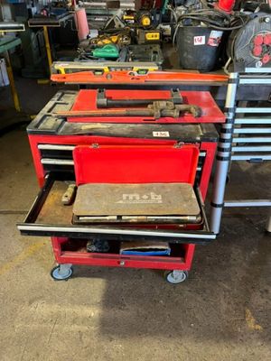 many tools on the cart in the garage