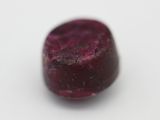 a close up of a piece of fruit on a white surface